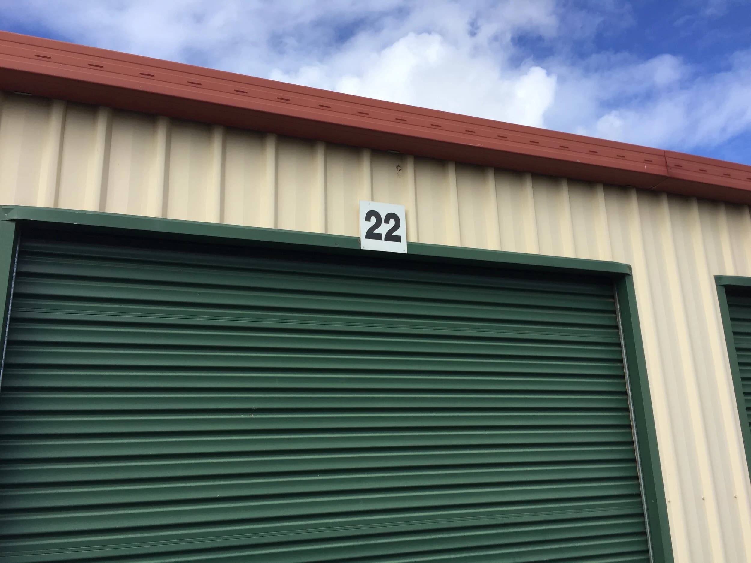 Green roller door on unit 22